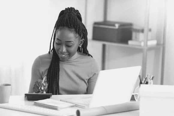 Accounting supervisor analyzing data on a computer