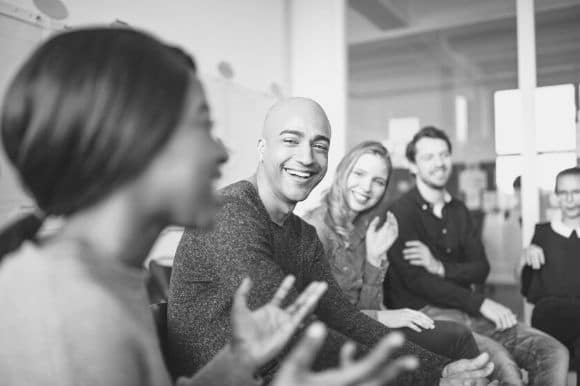 Members of an employee resource group gather for a meeting.