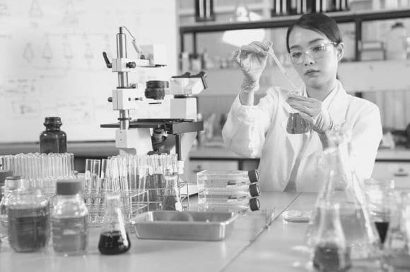 A medical technologist preparing samples in a lab.