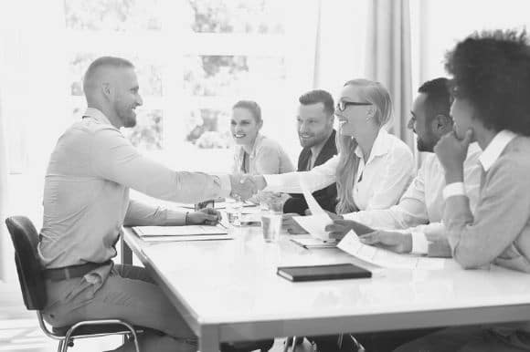 A hiring team conducting a panel interview.