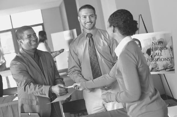 A company participating in a job fair, as part of their broader talent acquisition strategy.