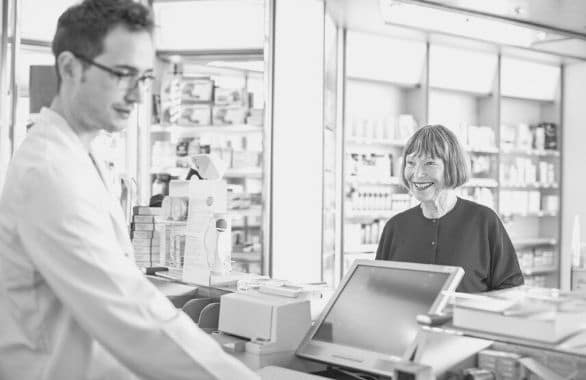 Unit clerk helping hospital visitor