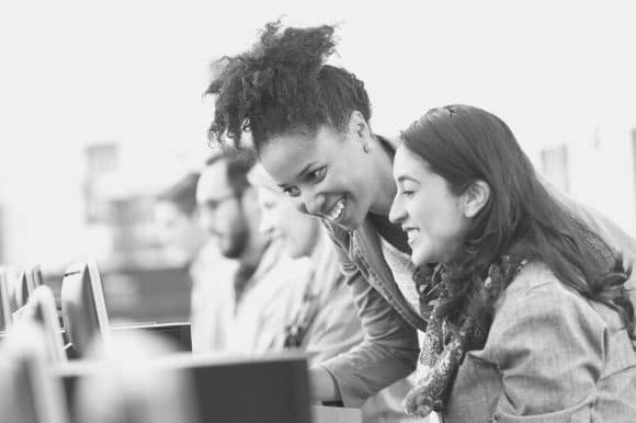 A manager working closely with one of her employees.