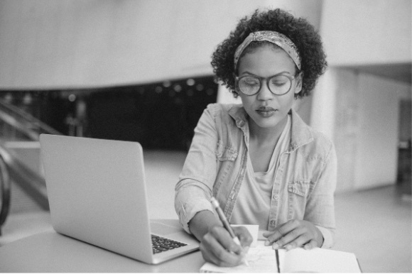 Woman working on a computer at a desk